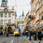 yellow-tram-driving-by-old-city-center-lviv-rynok-square