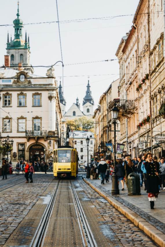 yellow-tram-driving-by-old-city-center-lviv-rynok-square